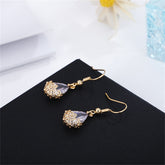 Exquisite 18K gold-plated crystal drop earrings, designed with floral elements to enhance your style effortlessly.
